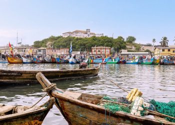 Wooden fishing canoes docked at shore reflecting artisanal fishing community life