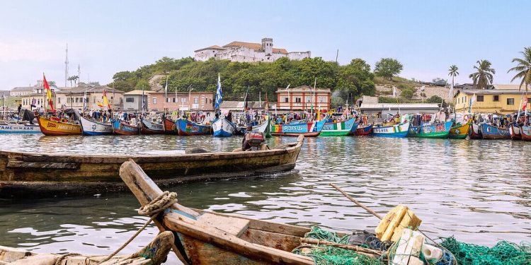 Wooden fishing canoes docked at shore reflecting artisanal fishing community life